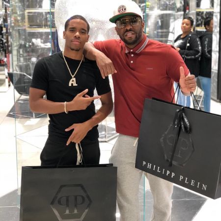 Ramone Malik Hill and his father Rocko were photographed with Phillipp Plein shopping bags in hand.